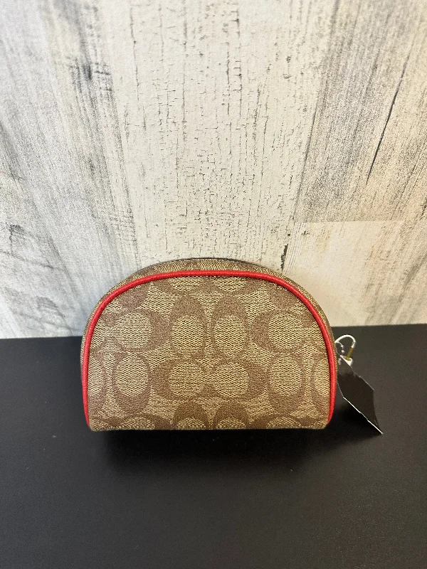 Coach Borough bags with a structured silhouette and a magnetic - snap closureCoin Purse Designer By Coach  Size: Large