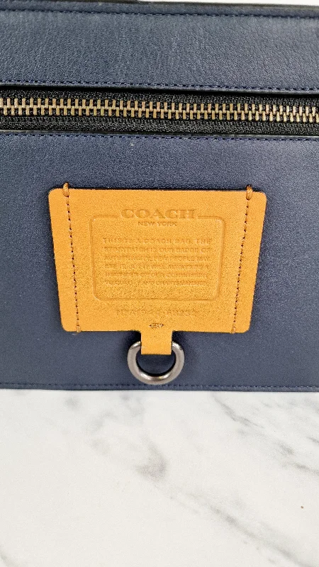 Ladies Coach crossbody bags with a single - strap design for simplicityCoach Rivington Convetible Pouch Clutch in Navy Blue Smooth Leather with Yellow Details - Coach 68232