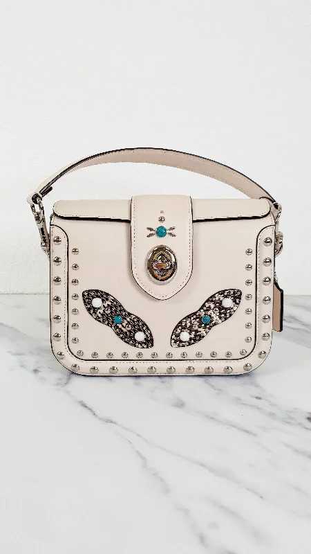 Coach handbags with a perforated leather detail for a breathable and unique designCoach Page Crossbody Bag in Chalk Smooth Leather With Western Rivets and Snakeskin - Handbag - Coach 86731