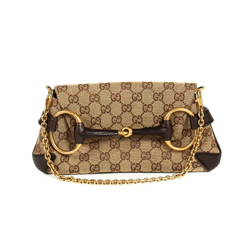 Women Gucci Sylvie bags with a monogram - embossed leatherGucci GG Canvas Horsebit Clutch