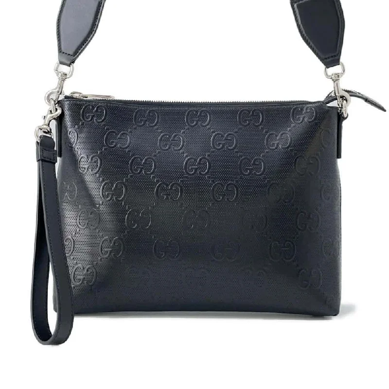 Ladies Gucci handbags with a detachable coin purse insideGUCCI GG-embossed messenger bag Black 696009 Leather