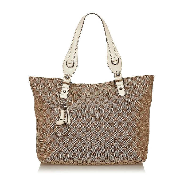 Women Gucci bags with a snap - button closure and a decorative charmGucci GG Canvas Icon Bit Tote Bag