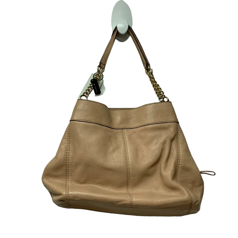 Coach tote bags with a snap - button closure and a decorative charm for styleTote Designer By Coach  Size: Medium