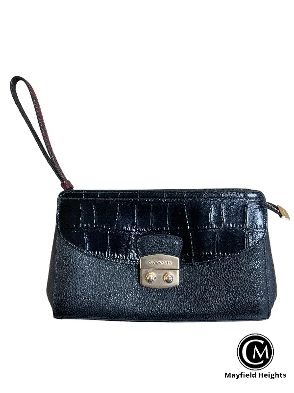 Coach Dempsey bags with a contrast - colored interior for visual interestWristlet Designer By Coach  Size: Medium