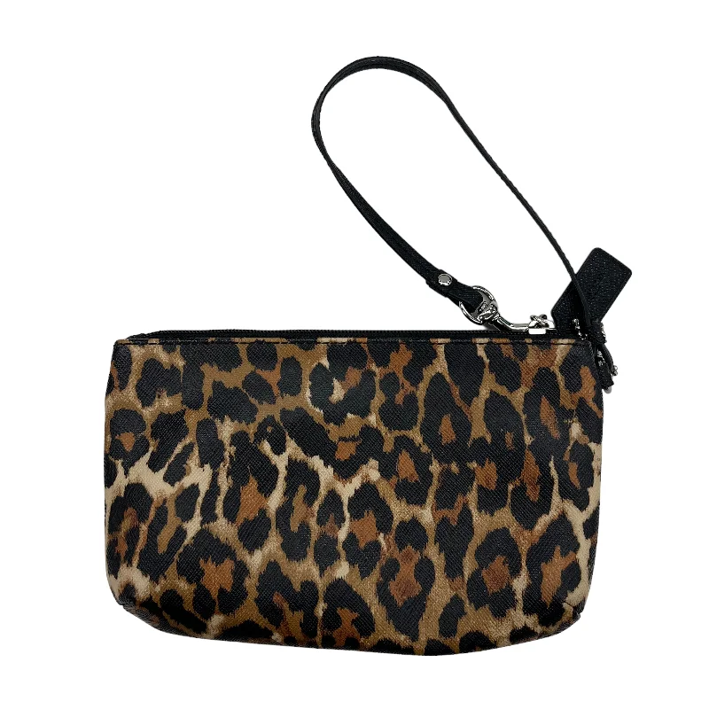 Coach Dempsey bags with a contrast - colored interior for visual interestWristlet Designer By Coach  Size: Medium