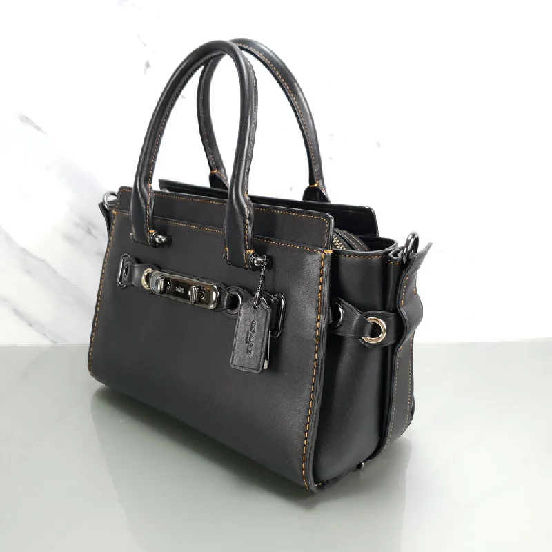 Ladies Coach Tabby bags with gold - toned hardware for a touch of luxuryCoach Swagger 27 in Black Glovetanned Leather with Link Detail - SAMPLE BAG