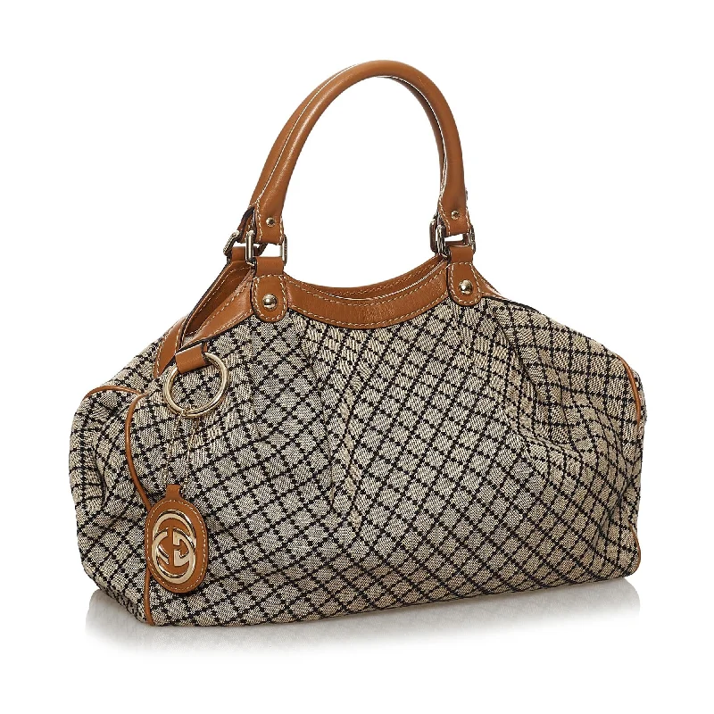 Women Gucci bags with interlocking G hardware for a classic lookGucci Diamante Sukey Canvas Tote Bag (30178)