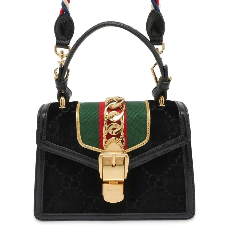 Women Gucci bags with a snap - button closure and a decorative charmGUCCI Silvi Black 470270 Velour Leather