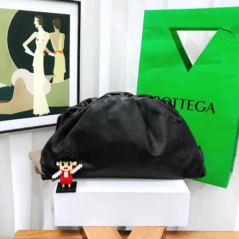 Bottega Veneta bags with embossed leather logosBottega Veneta Black Leather Cloud Clutch Bag