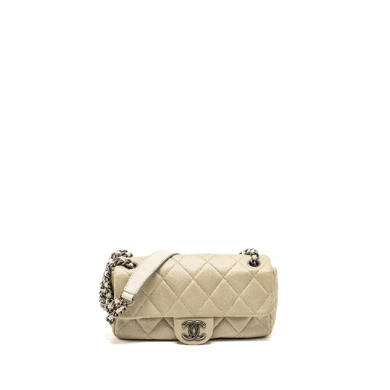 Chanel bags available at online luxury retaileChanel quilted flap shoulder bag caviar light beige ruthenium SHW