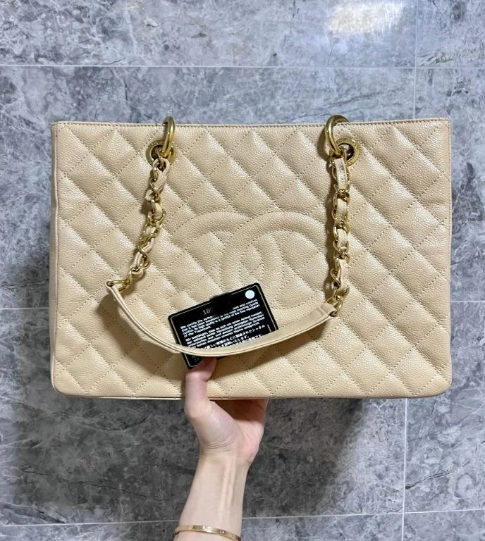 Chanel bags with iconic stitching detailsBeige Grand Shopping Tote GST with Gold Hardware Caviar