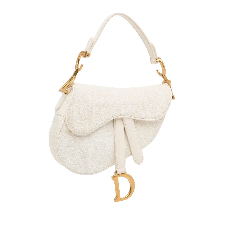 Christian Dior backpacks with a sleek, minimalist silhouetteDior Mini Oblique Saddle (4KTFrz)