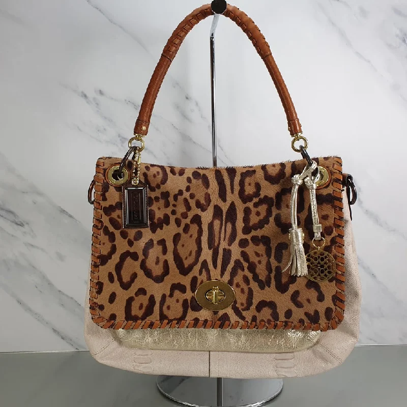 Coach Dempsey bags with a large capacity and a drawstring closureRare Coach Calf Hair Leopard Ocelot Snake Embossed Shoulder Bag