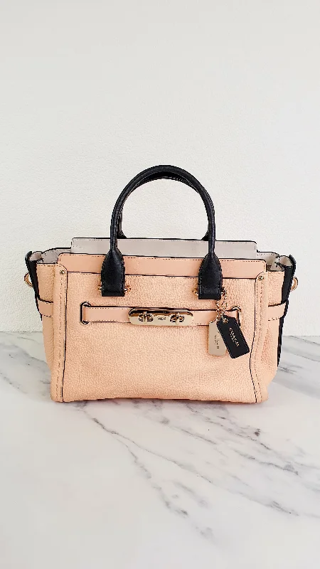 Coach crossbody bags in a vibrant, eye - catching color for a bold statementCoach Swagger 27 in Peach Salmon Pink with Colorblock Black Handles - Pebble Leather HandbagCrossbody Bag - Coach 34417